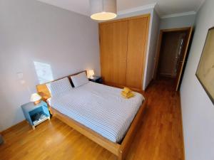 Katil atau katil-katil dalam bilik di Oporto Beach appartement