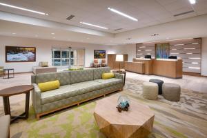 a living room with a couch and a table at Fairfield Inn & Suites by Marriott Denver West/Federal Center in Lakewood