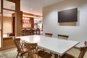 a dining room with a white table and chairs at Fairfield Inn & Suites by Marriott Denver West/Federal Center in Lakewood