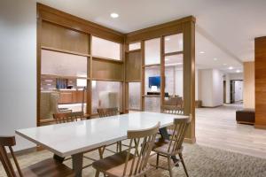 a dining room with a white table and chairs at Fairfield Inn & Suites by Marriott Denver West/Federal Center in Lakewood