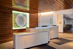 an office lobby with a painting on the wall at Fairfield Inn & Suites by Marriott Plymouth in Plymouth