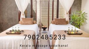 Kerala massage kodaikanal में एक कमरे में एक या कई बेड