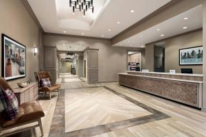 a hotel lobby with a reception desk and a hair salon at Residence Inn by Marriott Baltimore Downtown/ Inner Harbor in Baltimore