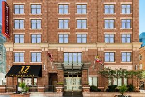 a large red brick building with a hotel at Residence Inn by Marriott Baltimore Downtown/ Inner Harbor in Baltimore