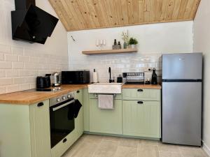 A kitchen or kitchenette at High Five Villas