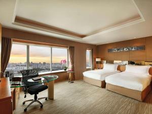 Voodi või voodid majutusasutuse Sofitel Xi'an On Renmin Square toas