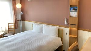 Кровать или кровати в номере Toyoko Inn Morioka eki Minami guchi Ekimae