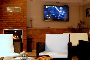 TV at/o entertainment center sa Gasthaus