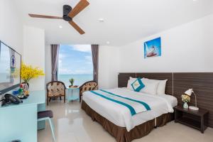 A bed or beds in a room at Annata Beach Hotel