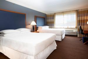 Tempat tidur dalam kamar di Sheraton Niagara Falls