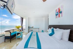 A bed or beds in a room at Annata Beach Hotel