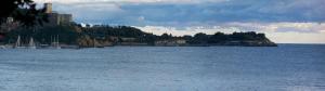 a large body of water with a town on a hill at Locanda del Sole Nero in San Terenzo