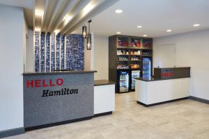 a hello hamilton store with a reception desk and a pharmacy at TownePlace Suites by Marriott Hamilton in Hamilton