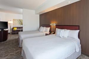 Giường trong phòng chung tại SpringHill Suites by Marriott El Paso