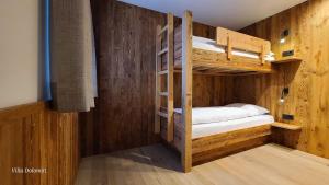 Cama ou camas em um quarto em Villa Dolomiti