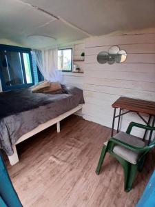 A bed or beds in a room at Green House Hostel