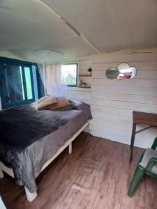 A bed or beds in a room at Green House Hostel