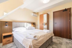 Ліжко або ліжка в номері Hotel Perła Dunajca