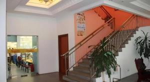 a hallway with a staircase in a building at Grand City Hotel in Bandar Seri Begawan