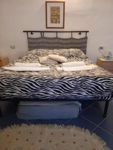 A bed or beds in a room at Affittacamere da Liliana