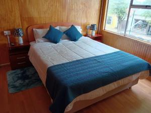 Una cama o camas en una habitación de Hostal Reymar