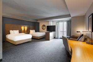 Tempat tidur dalam kamar di Residence Inn by Marriott Halifax Downtown