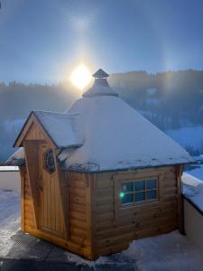 a building with snow on the top of it at Sun Chalet in Schladming