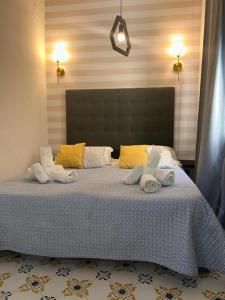 Una cama o camas en una habitación de Hotel Palma