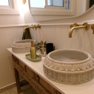 a bathroom with a large stone sink on a counter at Studio 34 - Nelson Bay in Nelson Bay