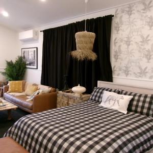 a living room with a bed and a couch at Studio 34 - Nelson Bay in Nelson Bay