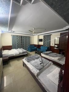 Mussiaree Hotel में एक कमरे में एक या कई बेड