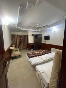 Mussiaree Hotel में एक कमरे में एक या कई बेड