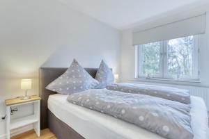 Una cama o camas en una habitación de Ferienwohnung AHOI