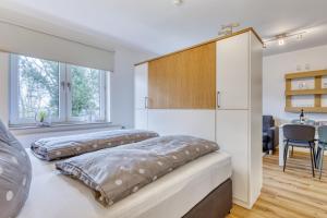 Una cama o camas en una habitación de Ferienwohnung AHOI