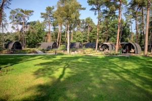 Сад в KampinaStaete, hippe cottages midden in natuurgebied de Kampina Oisterwijk