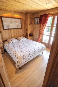 Una cama o camas en una habitación de Appartement confortable a Megeve | 46m² | Vue sur montagne