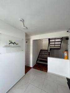 an empty room with a staircase in a building at Céntrico Aparta-estudio in Pereira