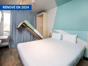 Una cama o camas en una habitación de Ibis Budget Lyon Caluire Cité Internationale