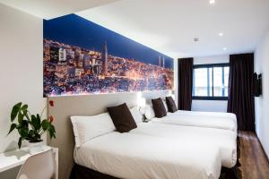 A bed or beds in a room at Hotel BESTPRICE Gracia