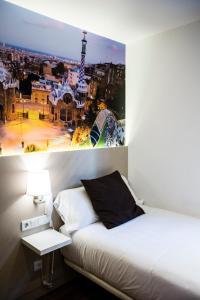 A bed or beds in a room at Hotel BESTPRICE Gracia