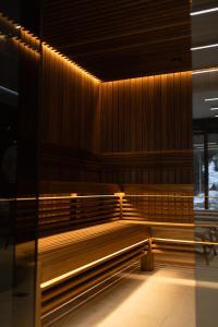 an empty bench in a building with lights on it at Continental SPA Resort in Bukovel