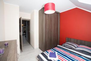 Una cama o camas en una habitación de Apartament Stella Polare