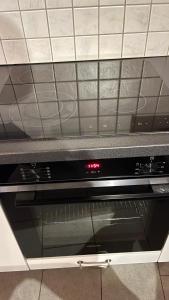 a close up of an oven in a kitchen at Quiet Flat in Nature in Lugano in Lugano