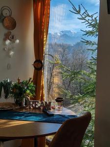 a window with a view of a mountain view at Touch the Sky in Moieciu de Jos