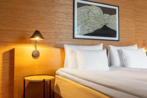 Giường trong phòng chung tại Hotel G Gothenburg