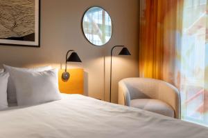 Giường trong phòng chung tại Hotel G Gothenburg