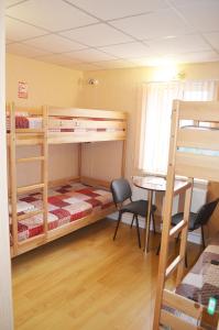 מיטה או מיטות בחדר ב-Hostel VIP Na Pestelya, 11