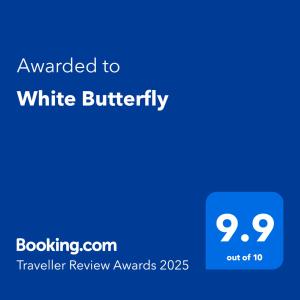 a blue text box with the words awarded to white butterfly at White Butterfly - A Countryside Homestay in Trivandrum