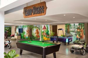 a billiard room with a pool table and a ping pong ball at Hyatt Centric Candolim Goa in Calangute