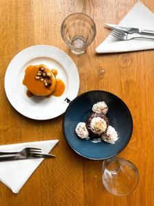 two plates of food on a wooden table at The People - Tours in Tours